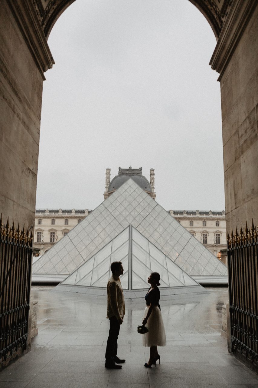 Couple in the rain Louvre Museum Paris Photography