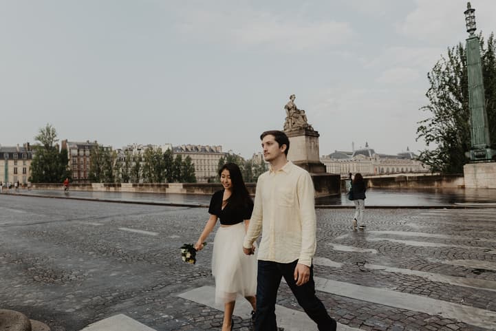 Couple photography crossing street Seine river Paris