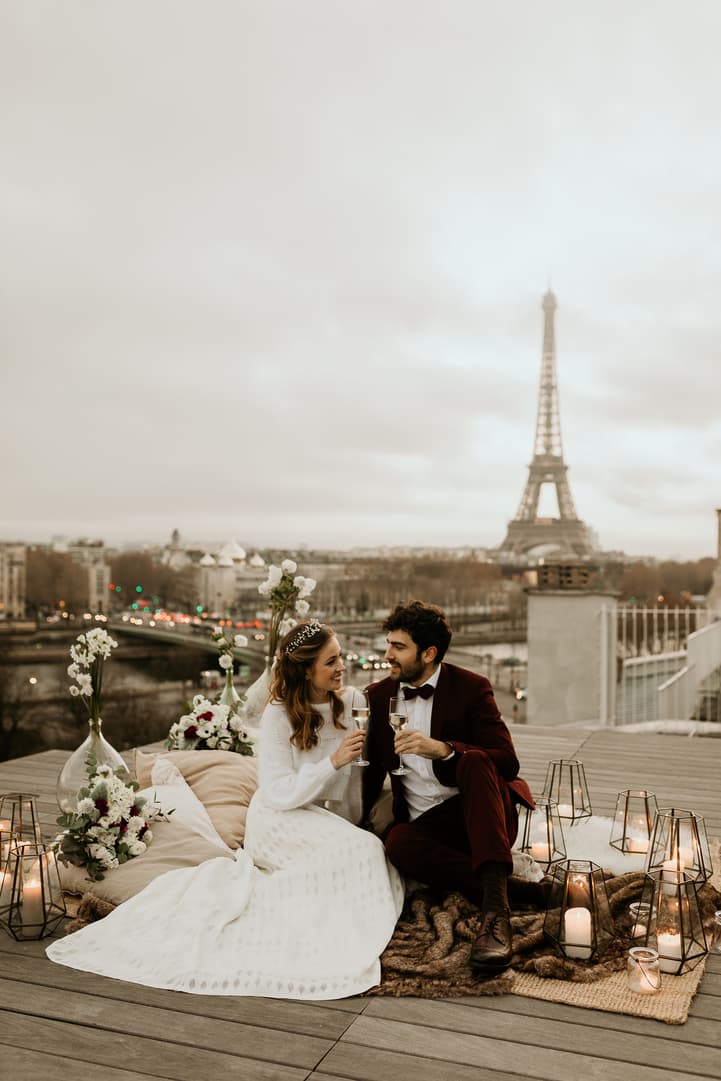 couple paris rooftop champagne