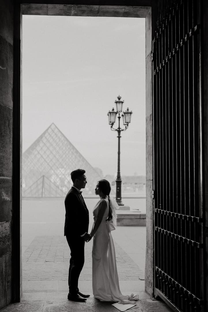 Engagement photo at the Louvre pyramid, Paris