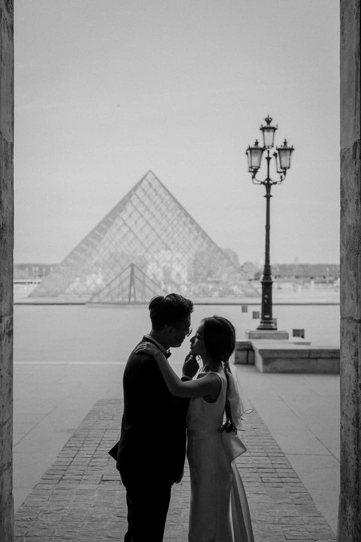 Engagement photo at the Louvre pyramid, Paris