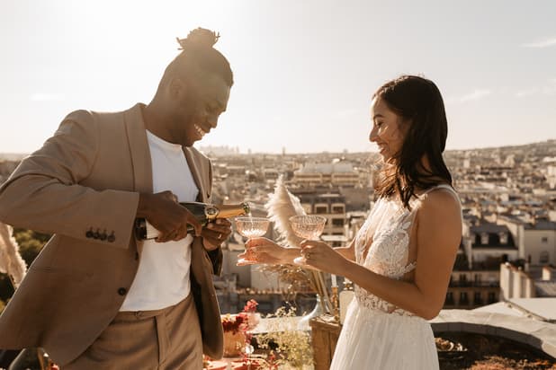 elopement celebration paris rooftop with mixed couple