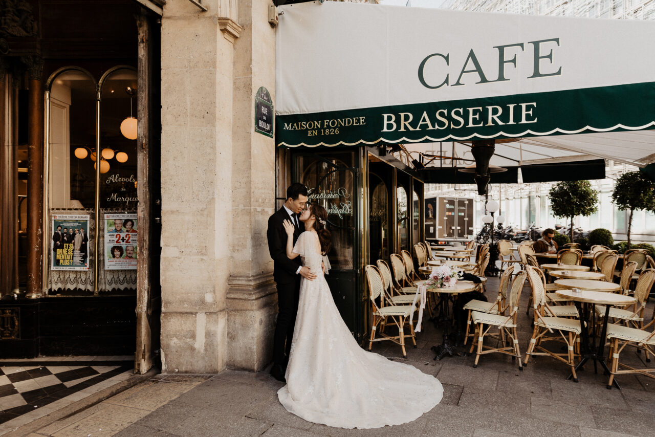 Bride and groom at a cafe in Paris
