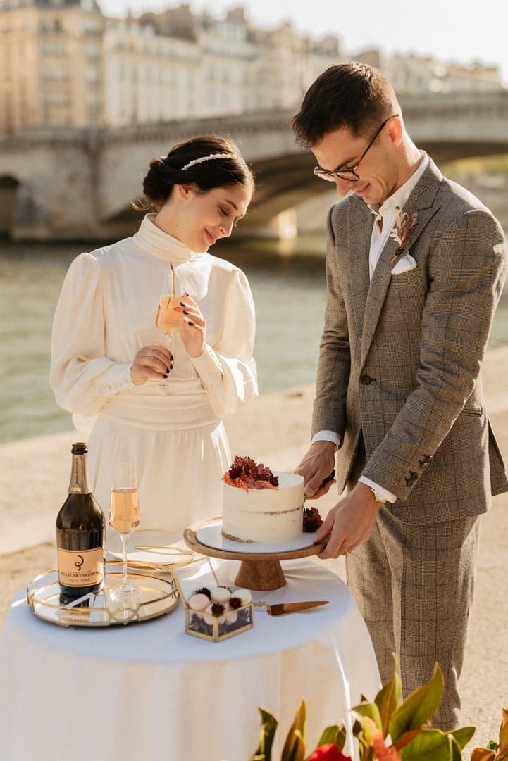 Bride and groom cut wedding cake after elopement ceremony