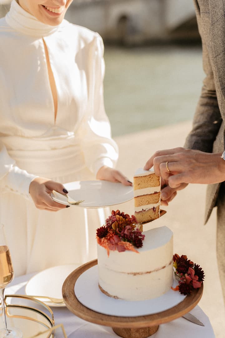 Bride and groom cut wedding cake after elopement ceremony