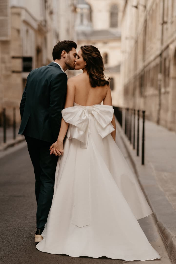 Paris wedding photography stylish bride with big bow wedding dress