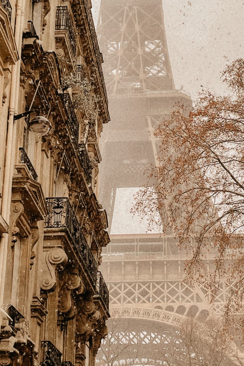 Eiffel tower snow paris haussmanian building france