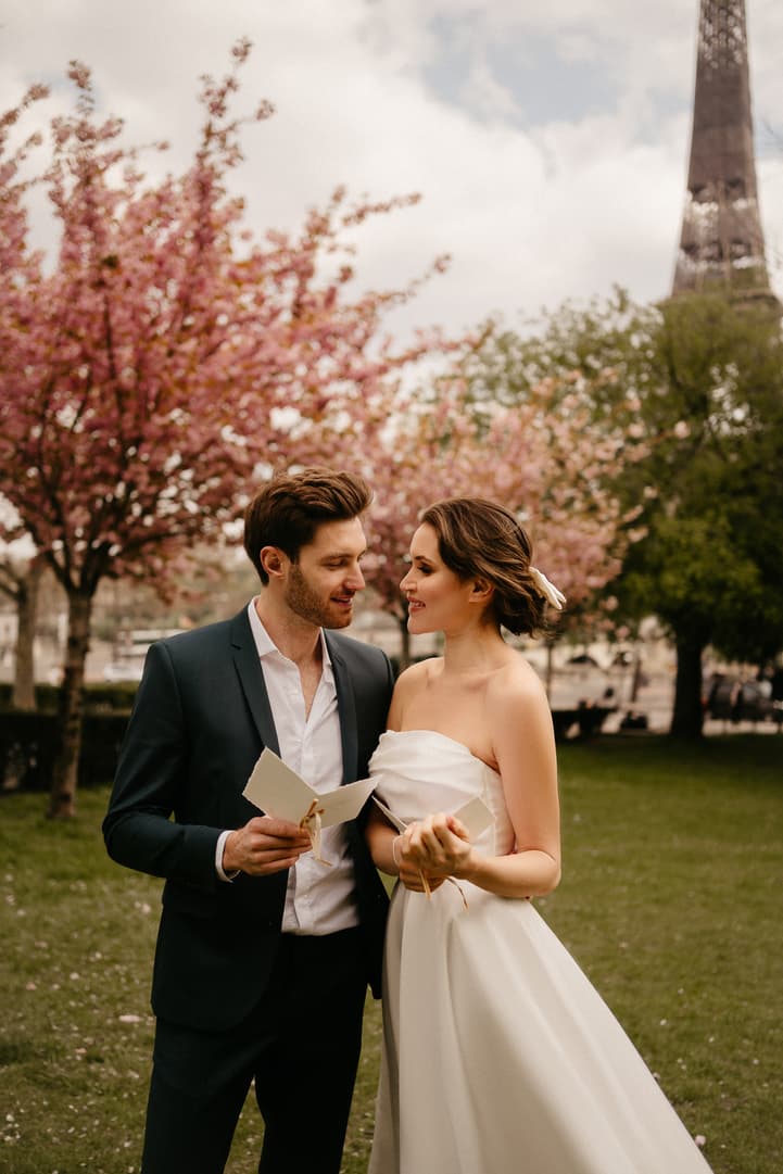 Cherry blossoms spring couple elopement wedding ceremony by Eiffel tower photoshoot