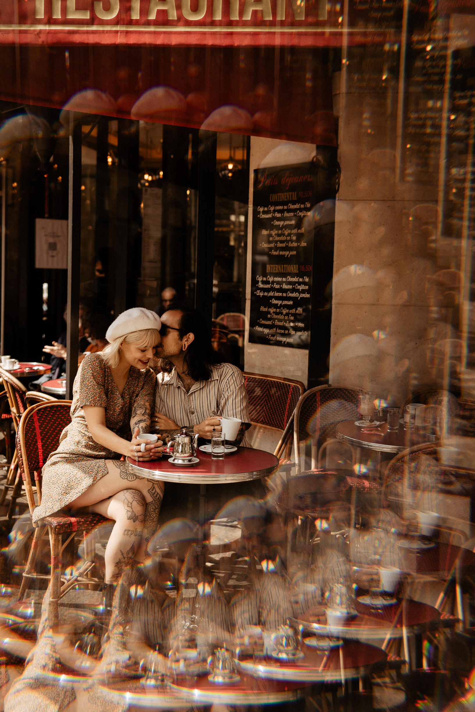 Couple engagement drinking coffee in paris