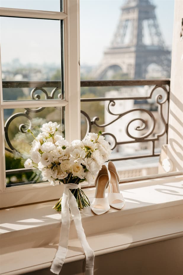 white wedding flowers bouquet with Eiffel tower backdrop at shangri-la hotel paris