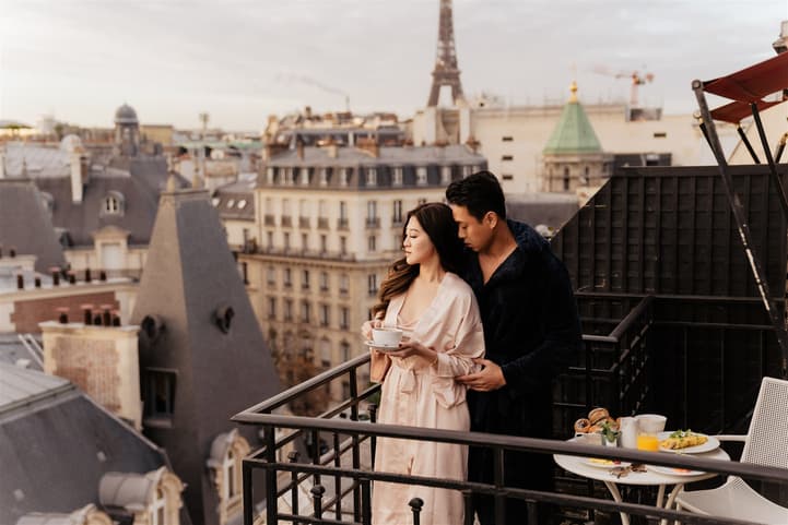 Breakfast on a rooftop terrace pre-wedding shoot with a breathtaking view of Paris's skyline and Eiffel Tower