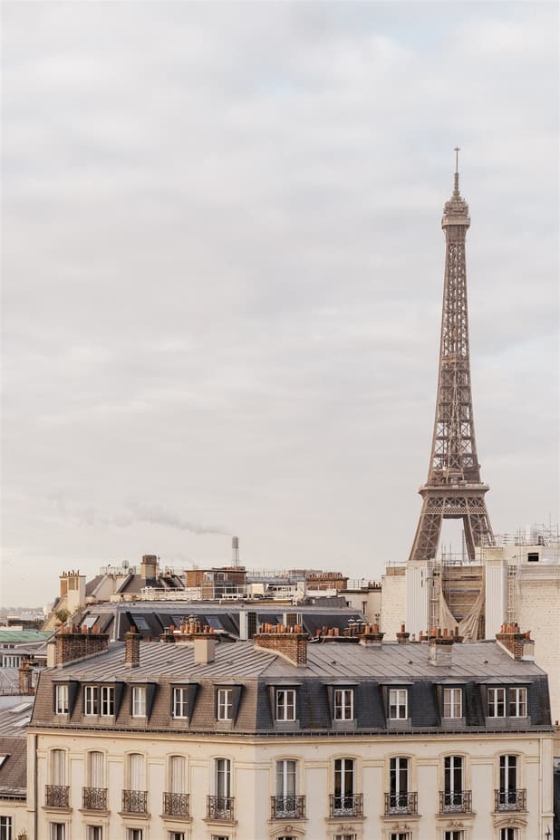 Breakfast on a rooftop terrace pre-wedding shoot with a breathtaking view of Paris's skyline and Eiffel Tower