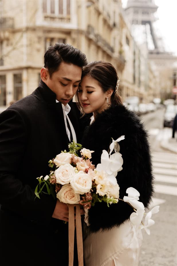 Couple Portrait pre-wedding shoot in the busy streets of Paris with banquette