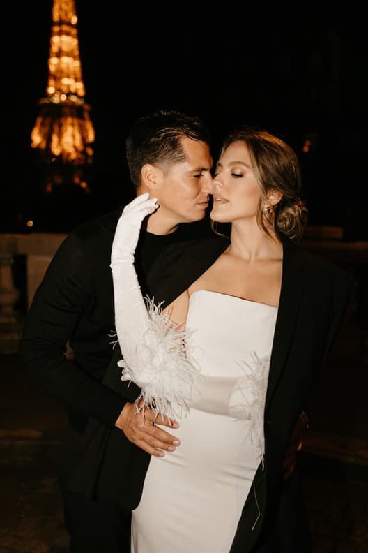 Eiffel tower backdrop couple photoshoot paris at night with high fashion couple engagement