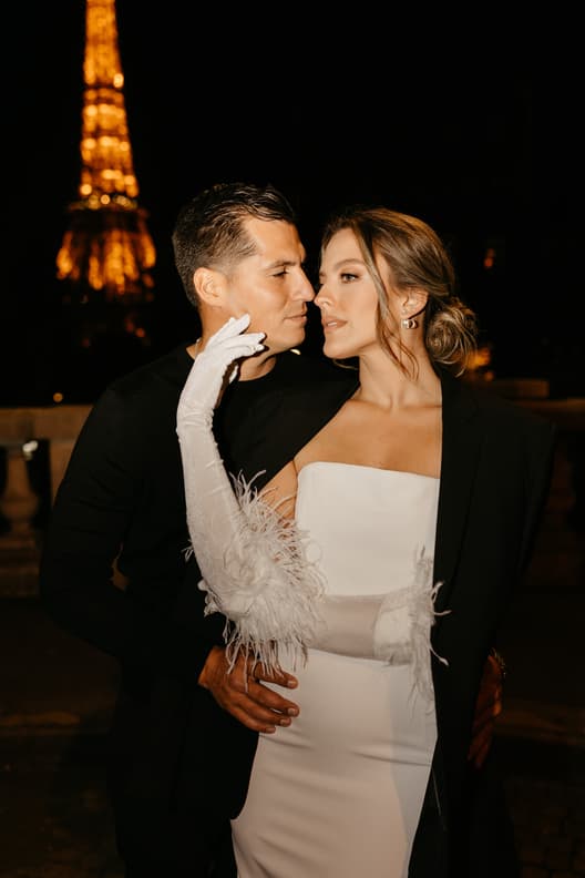 Eiffel tower backdrop couple photoshoot paris at night with high fashion couple engagement