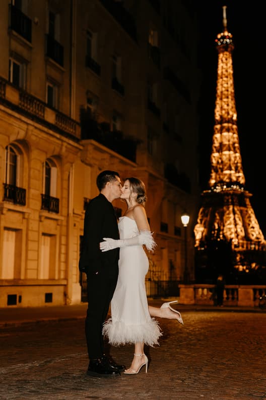 Eiffel tower backdrop couple photoshoot paris at night with high fashion couple engagement