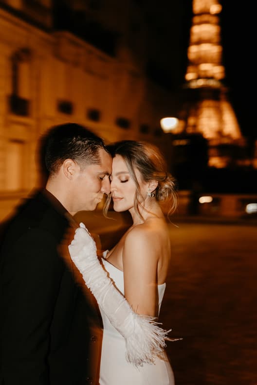 Eiffel tower backdrop couple photoshoot paris at night with high fashion couple engagement