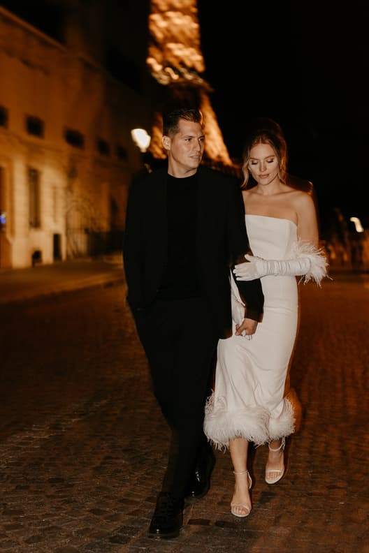 Eiffel tower backdrop couple photoshoot paris at night with high fashion couple engagement