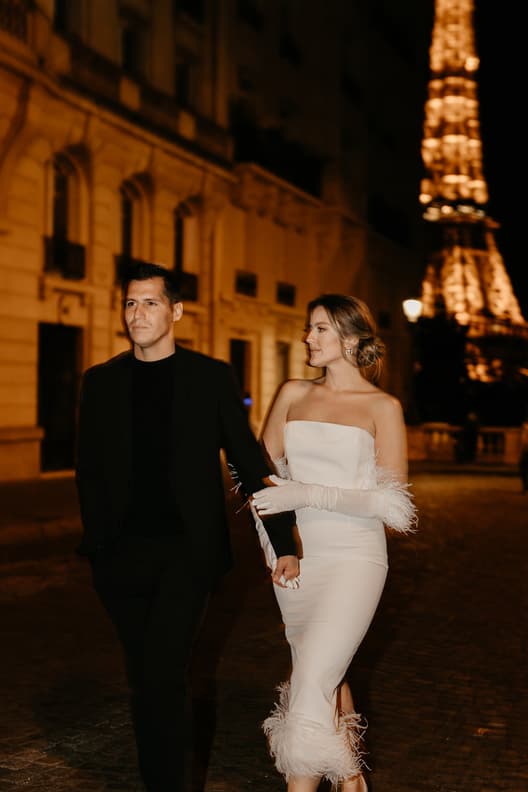 Eiffel tower backdrop couple photoshoot paris at night with high fashion couple engagement