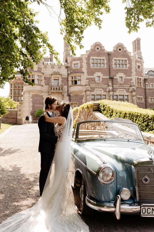 Stunning views of Couples Wedding Portrait shots in a castle with vintage car