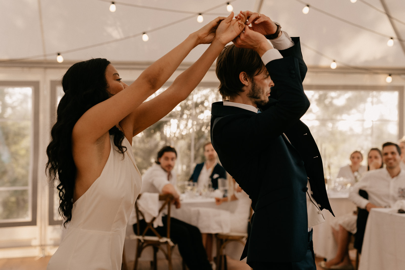 Bride and grooms first dance in chic boho wedding reception