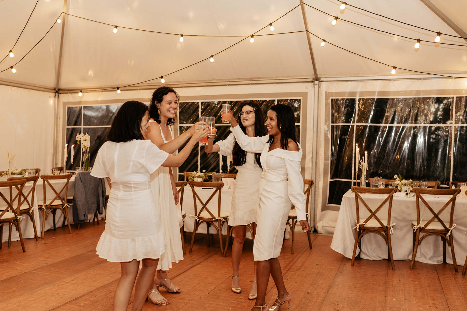 Bridesmaids dancing in dinner reception