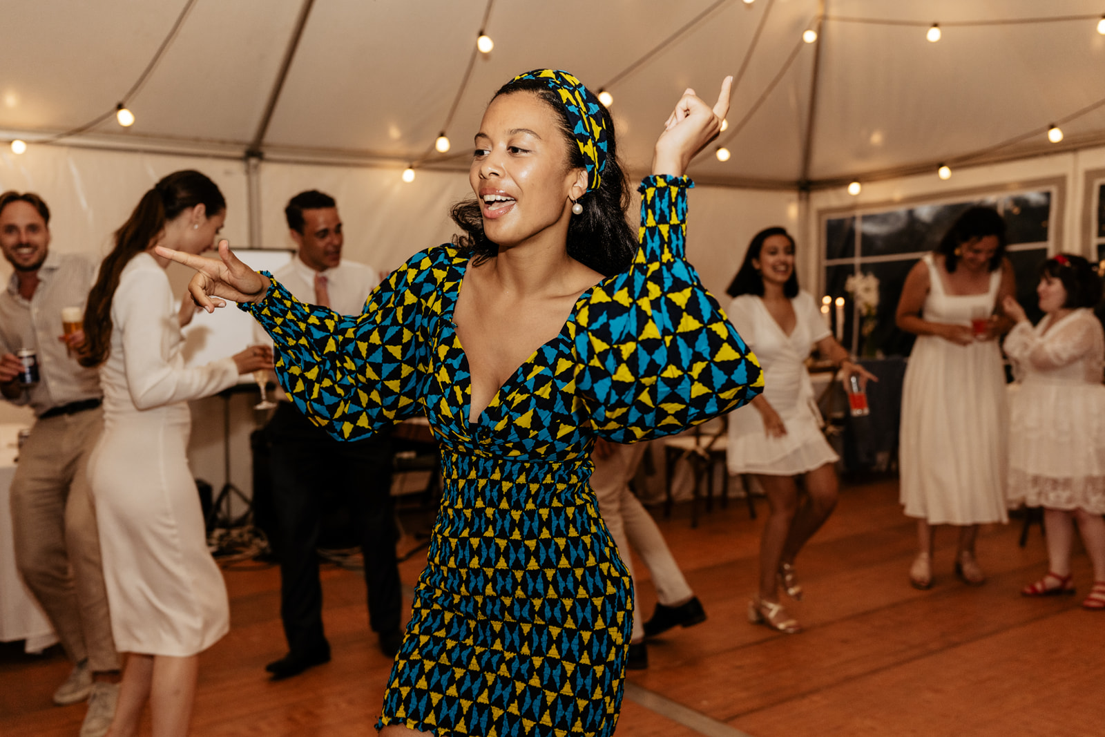 Bride dancing away in wedding reception in traditional clothing