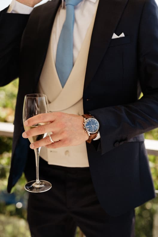 Groom Popping Champagne & Celebrating with Groomsmen 