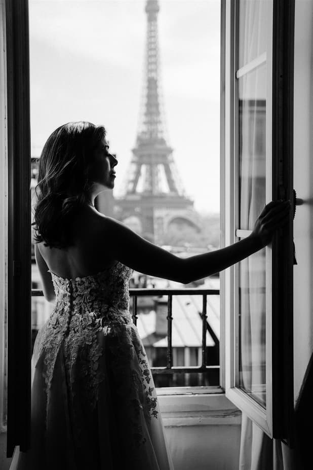 black an white bride photoshoot + Eiffel Tower from window view