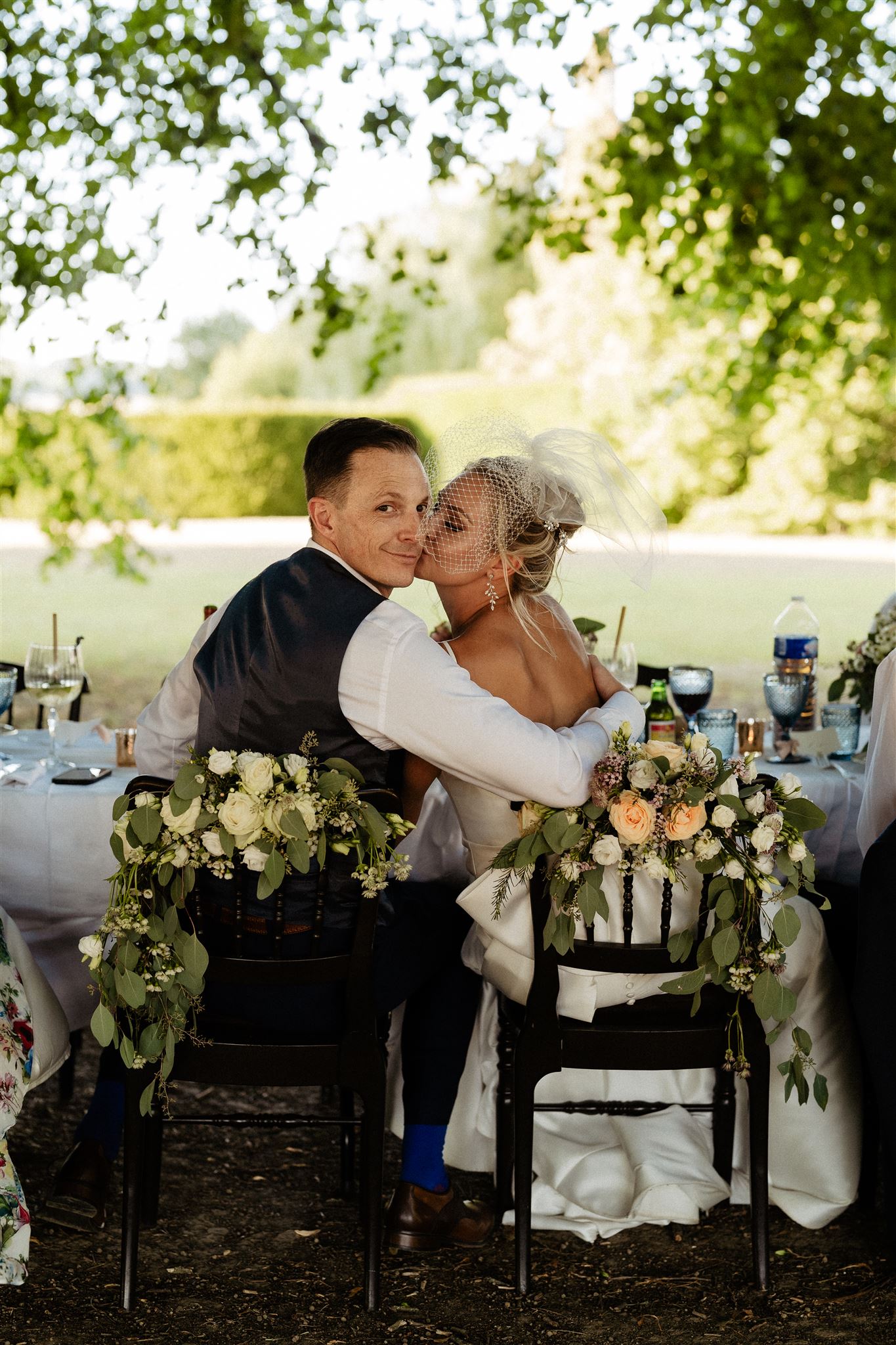 Outdoors dinner reception of Chateau wedding bride & groom