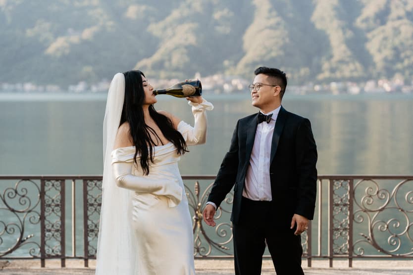 Villa Balbiano elopement wedding destination couple popping champagne Italy destination wedding photographer videographer