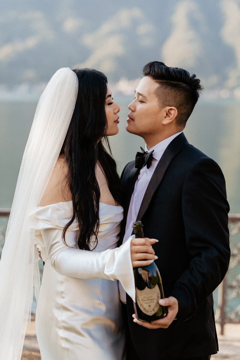 Villa Balbiano elopement wedding destination couple popping champagne Italy destination wedding photographer videographer