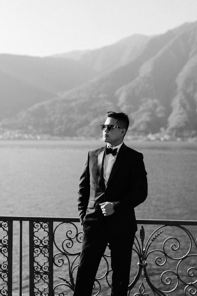 Elopement wedding Mandarin Oriental groom drinking and preparing at the bar Italy destination wedding photographer videographer
