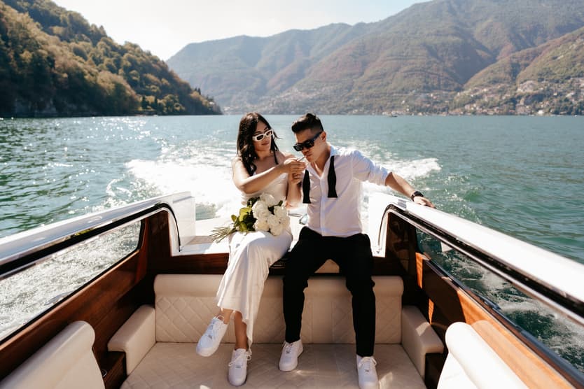 Elopement wedding Lake Como boat ride couple photoshoot Italy destination wedding photographer videographer