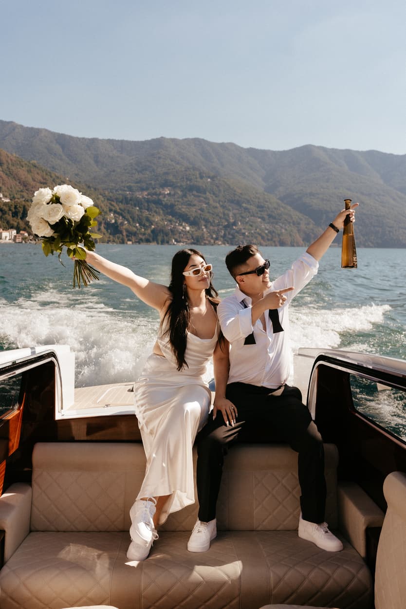 Elopement wedding Lake Como boat ride couple photoshoot Italy destination wedding photographer videographer