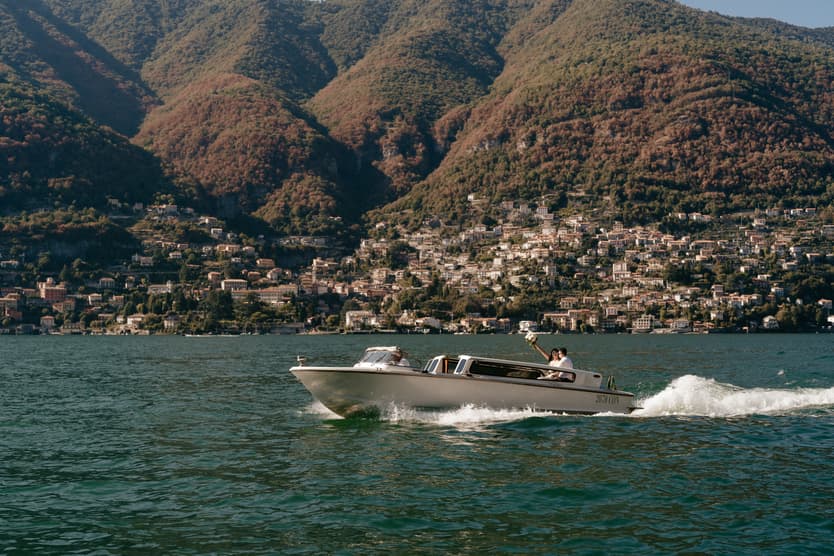 Elopement wedding Lake Como boat ride couple photoshoot Italy destination wedding photographer videographer