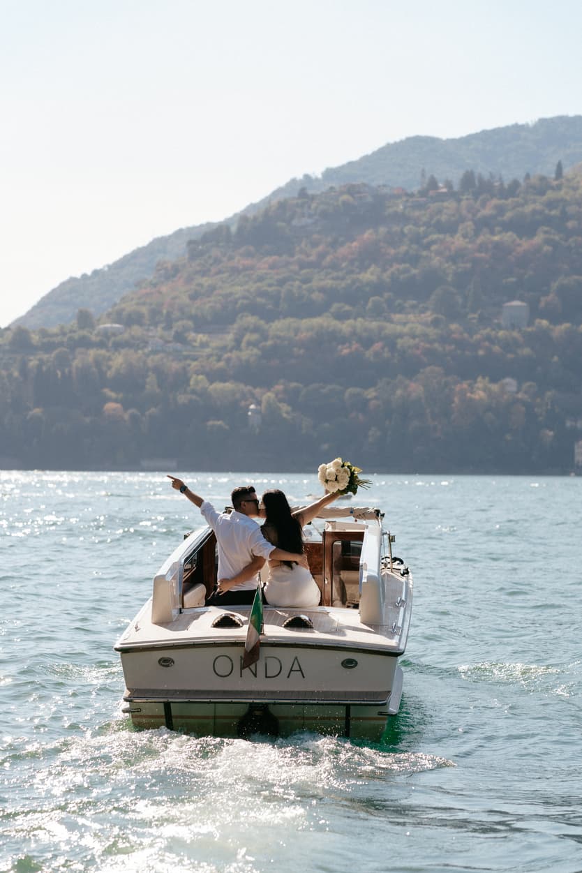 Elopement wedding Lake Como boat ride couple photoshoot Italy destination wedding photographer videographer