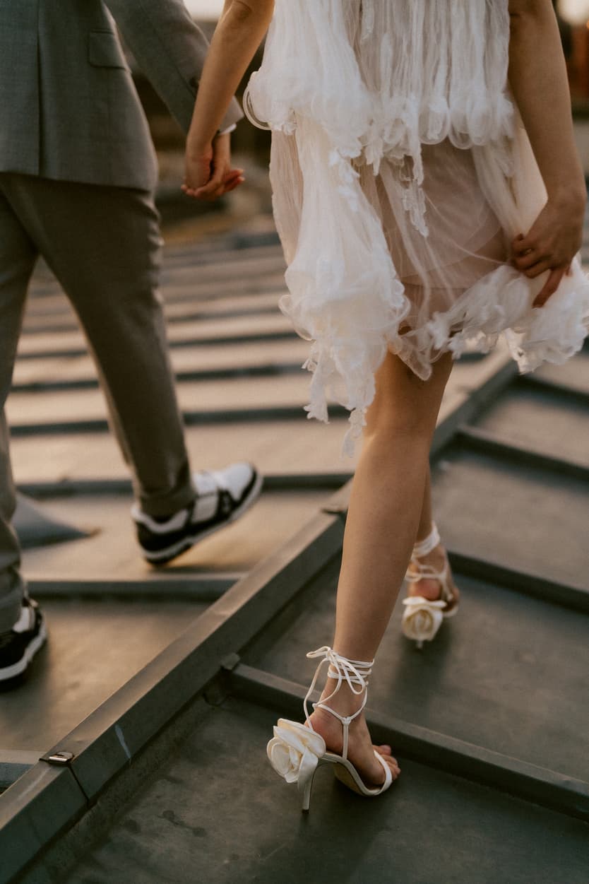 Couples Sunset Pre-wedding Photoshoot in Parisian rooftop detail on shoes 