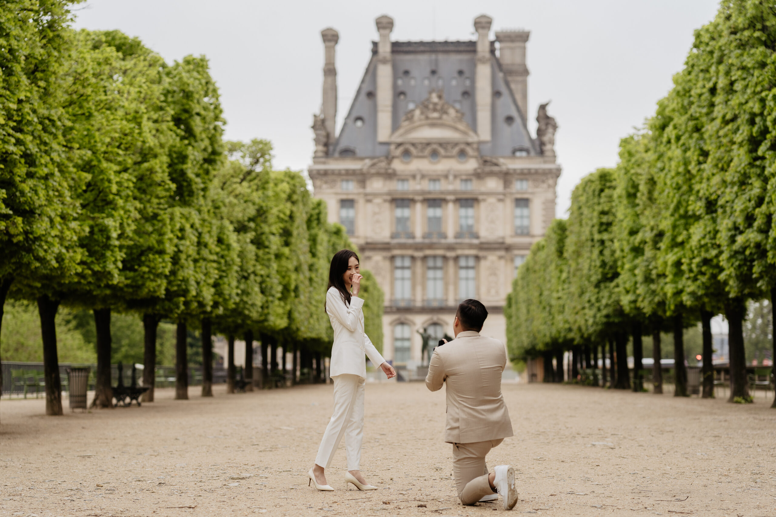 Couple full-day Pre-wedding Photoshoot in Paris Tuileries Garden matching suits 