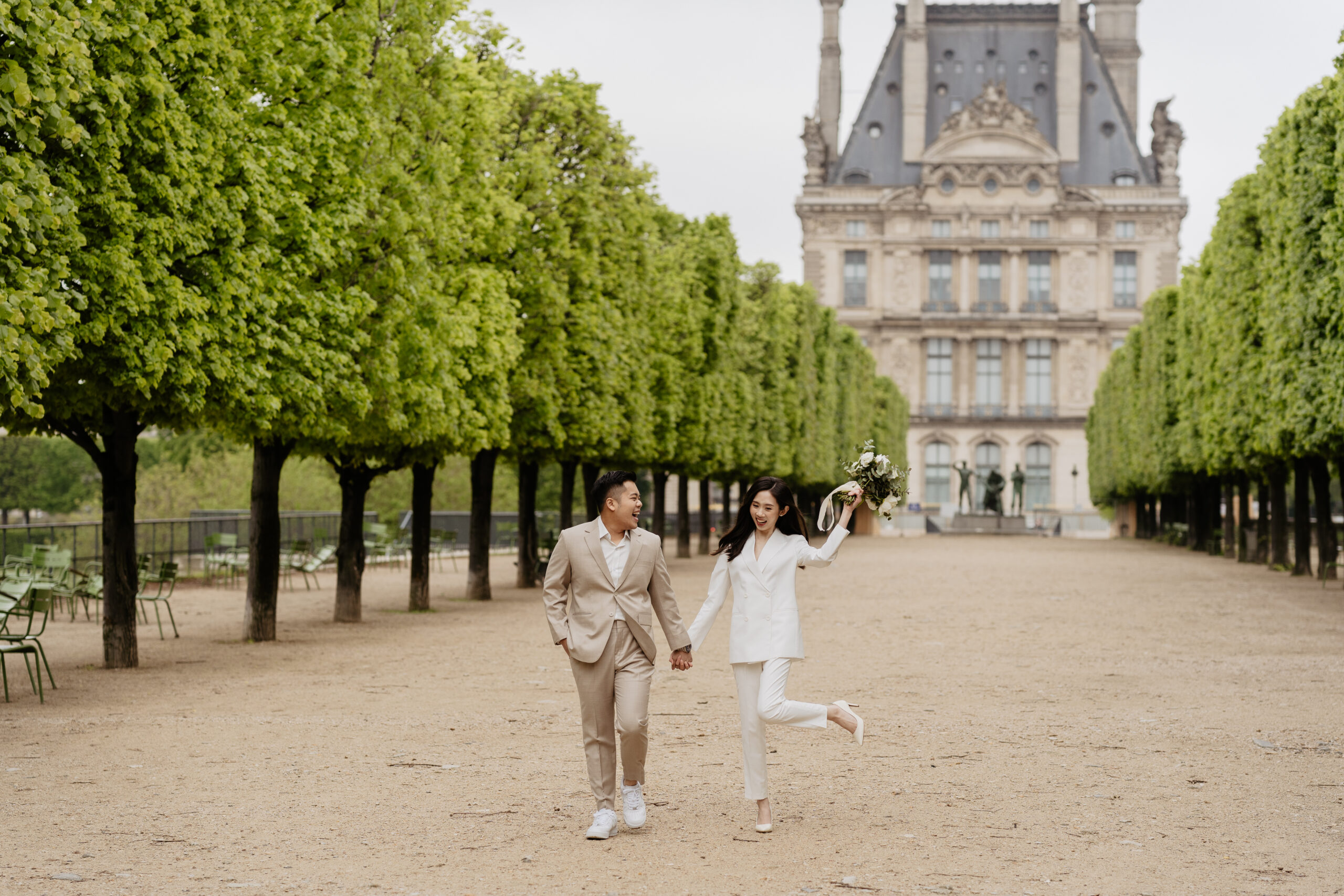 Couple full-day Pre-wedding Photoshoot in Paris Tuileries Garden matching suits 