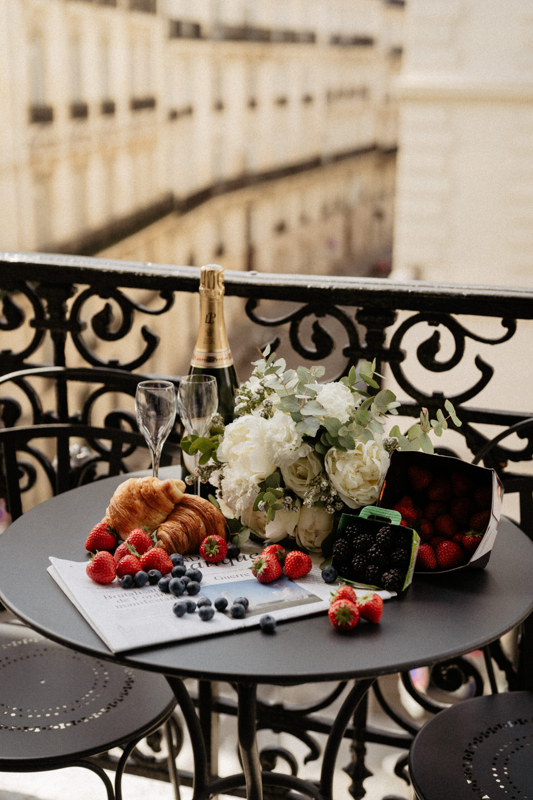 Couple full-day Pre-wedding Photoshoot in Paris hotel balcony with wine and fruits