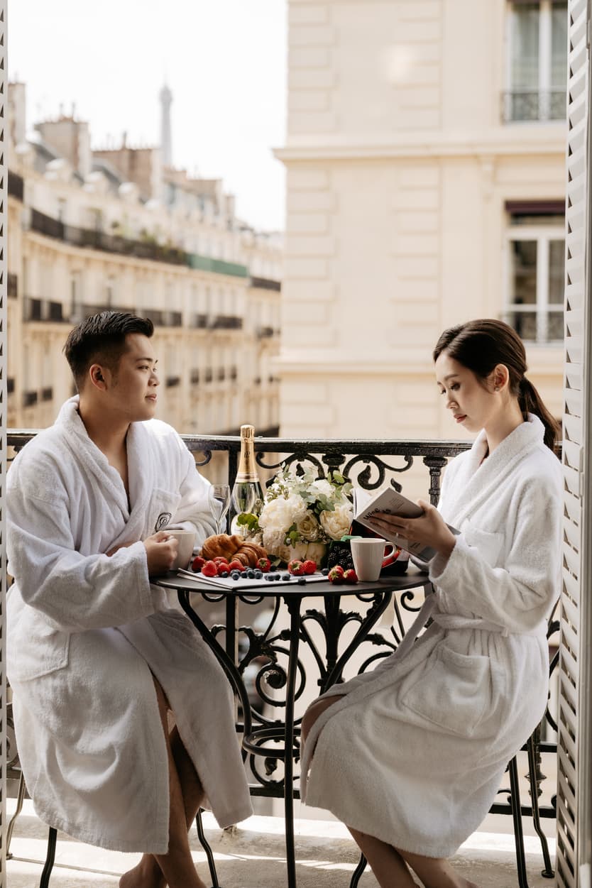 Couple full-day Pre-wedding Photoshoot in Paris hotel balcony with couple having breakfast