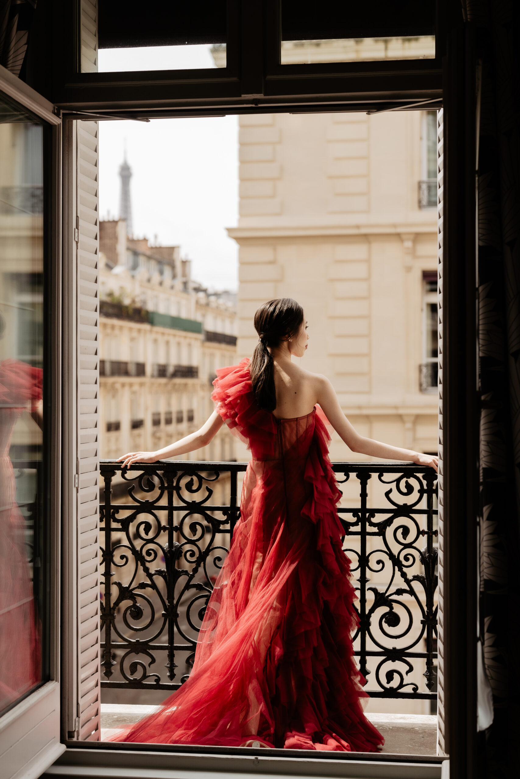 Couple full-day Pre-wedding Photoshoot in Paris hotel balcony, bride  with red dress 