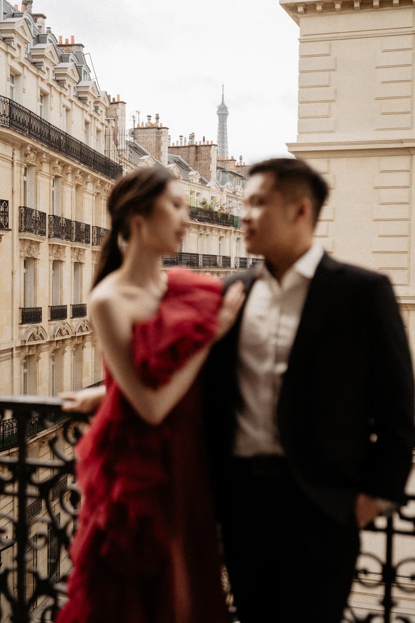 Couple full-day Pre-wedding Photoshoot in Paris hotel balcony, bride with red dress