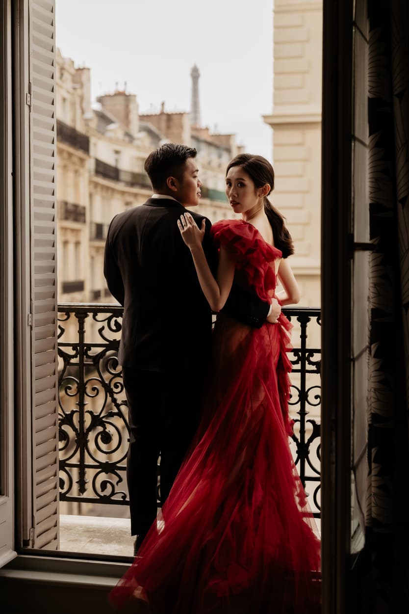 Couple full-day Pre-wedding Photoshoot in Paris hotel balcony, bride with red dress