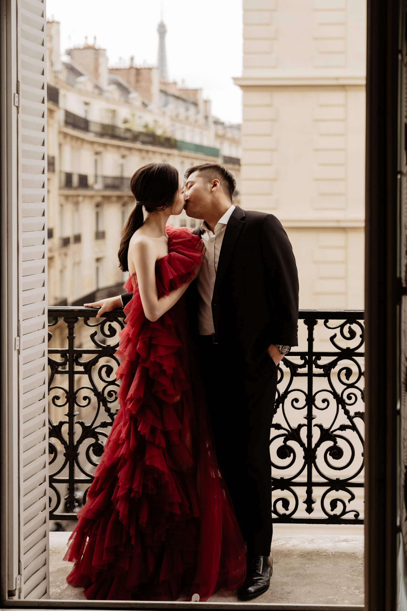 Couple full-day Pre-wedding Photoshoot in Paris hotel balcony, bride  with red dress 