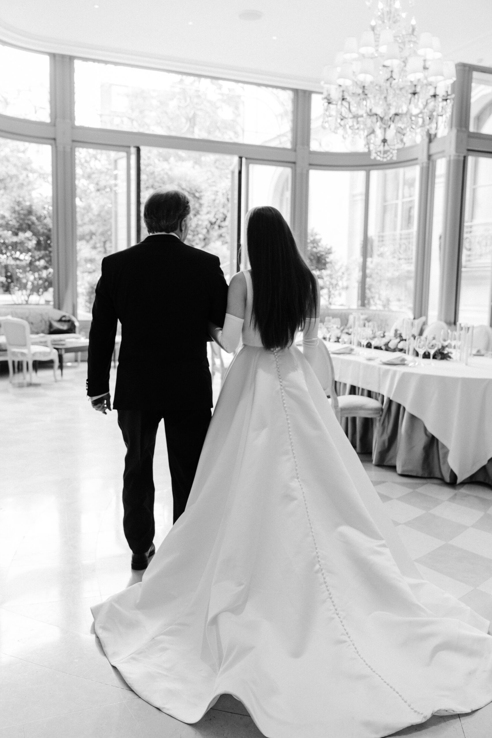 Destination wedding elopement at the luxurious Ritz Paris bride walking with dad 