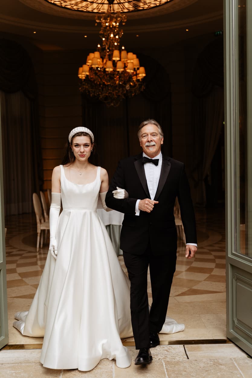 Destination wedding elopement at the luxurious Ritz Paris bride walking with dad