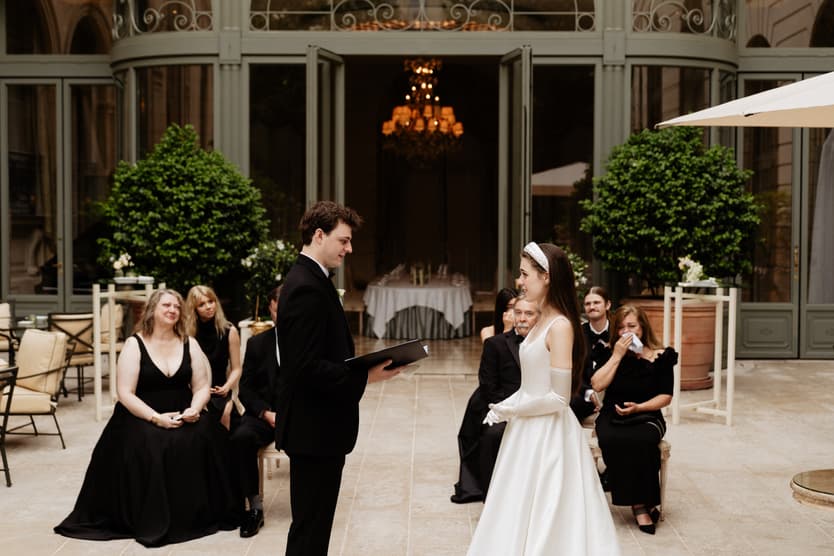 Destination wedding elopement at the luxurious Ritz Paris garden ceremony reading vows