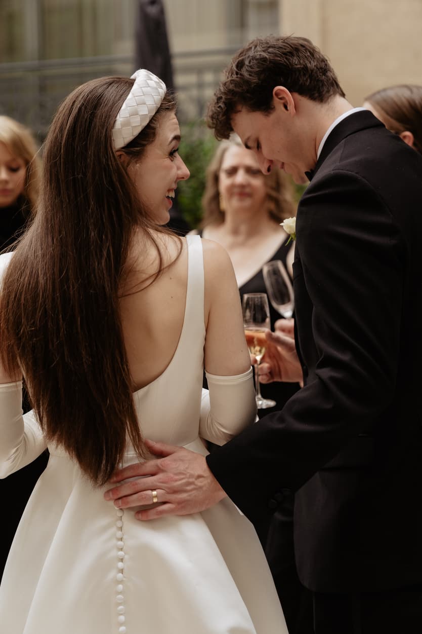 Destination wedding elopement at the luxurious Ritz Paris couple and families toasting